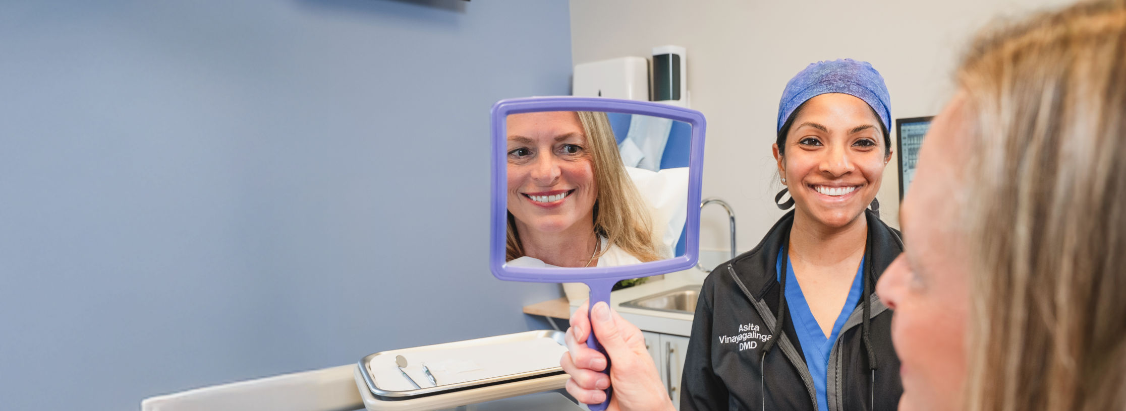 Asita Vinayagalingam, DMD, “Dr. V.” with a female patient in Dayton, OH