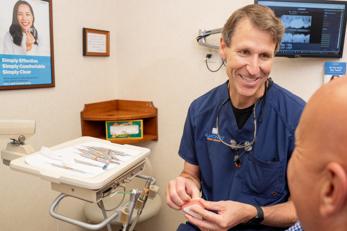 Dr. William Almoney consulting with a patient