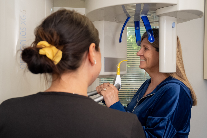 dental assistant with a patient getting a digital dental scan 
