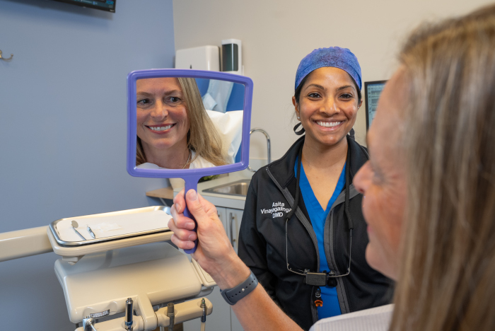 dental assistant with a patient at Almoney Dental Group in Dayton, OH