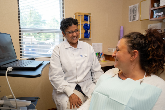 Dr. Manju conversing with a female patient