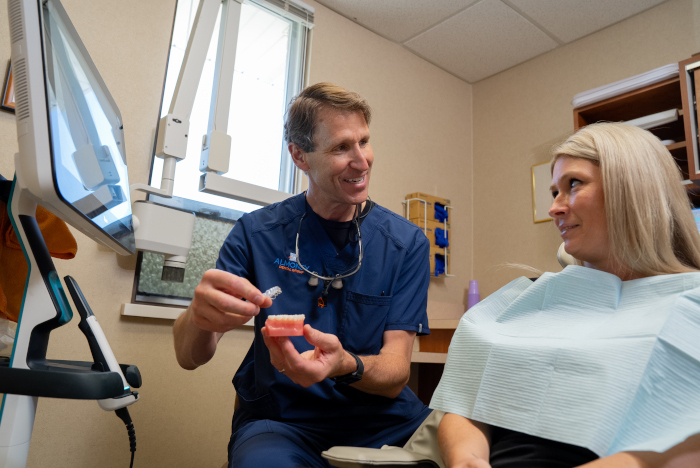 William D. Almoney, DDS with a female patient at Almoney Dental Group in Dayton, OH