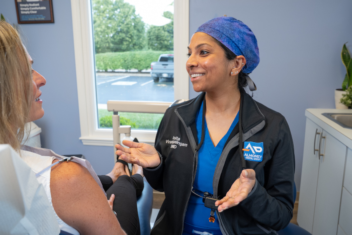 Asita Vinayagalingam, DMD with patient at Almoney Dental Group in Dayton, OH