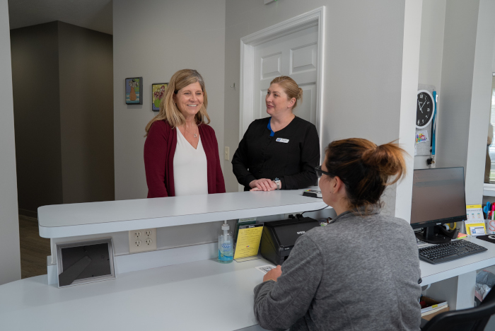 female patient with the receptionists
