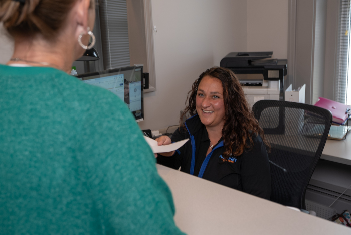 Destiny, Front Desk Coordinator with a patient