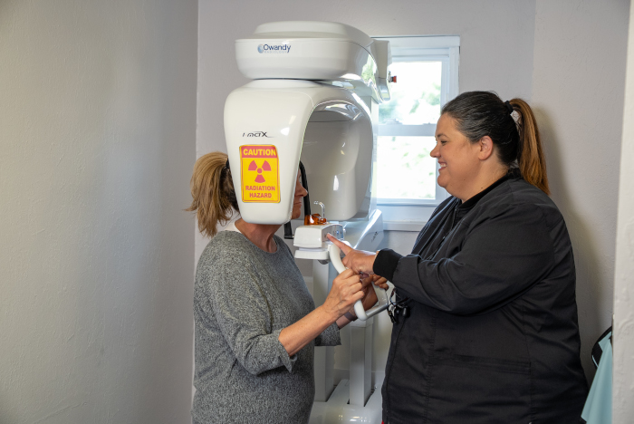 dental assistant with a patient getting a digital dental scan