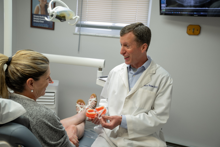 Gerald D. Brown, DDS with a female patient at Almoney Dental Group in Dayton, OH